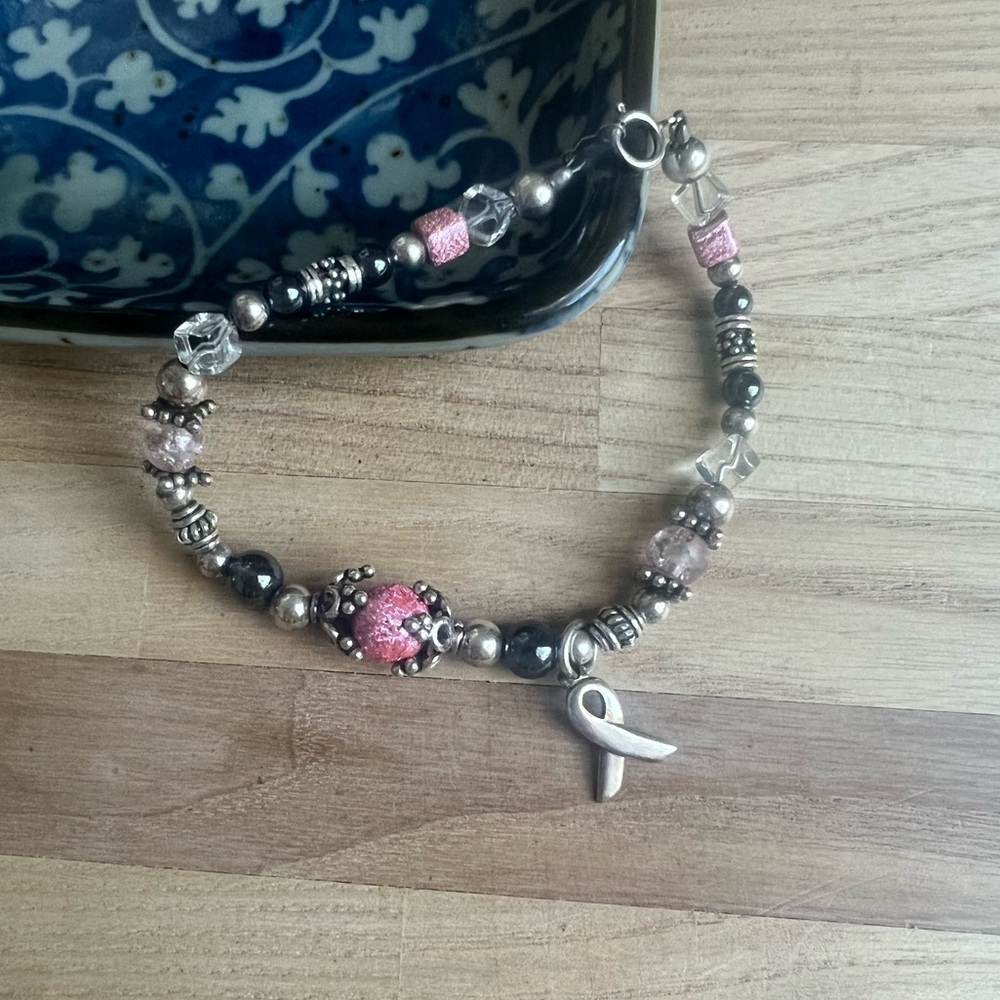 Pink and sterling silver beaded charm bracelet for breast cancer awareness